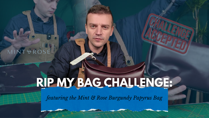 “Tanner Leatherstein reviewing the Mint & Rose Burgundy Papyrus bag during the Rip My Bag Challenge, with ‘Challenge Accepted’ stamped in the background.”
